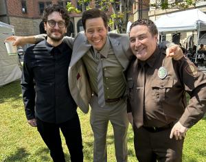 Smile director Parker Finn, Ike Barinholtz, and Damian Muziani on the set of The Studio.