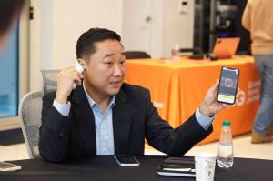 Otiton Medical CEO Jaeyoung Jayden Kim demonstrates the company’s solution during a global media meetup interview
