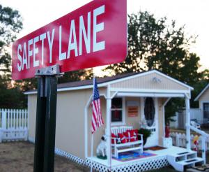 Building with a street sign "Safety Lane" just outside of it.