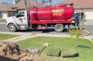 Sewer line cleaning service being performed by a plumbing technician in Bakersfield, California, to clear blockages and prevent backups.