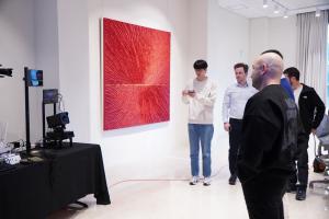 One of the journalists try AJ2's iris detection technology.