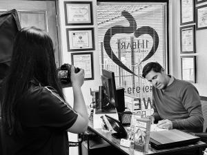 Armin Aryabod working at his desk inside the Careway LLC office in Tustin, California.