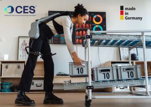 Woman lifting a crate being supported by the Exia exoskeleton from German Bionic