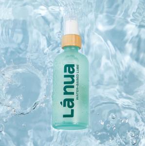 Bottle of La Nua personal lubricant floating in clear blue water