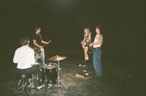 Members of Toronto indie rock band In Your Walls playing together during a rehearsal.