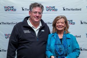 Glenn Merry and Mary Ellen Whitney pose with award