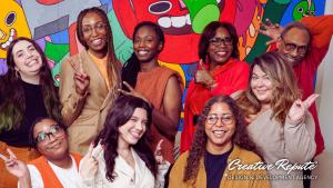 Group photo of Creative Repute team members smiling together at an in-person event in Philadelphia, showing a collaborative agency culture.