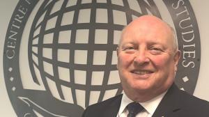 Photo of David Widdoson in front of CCES logo