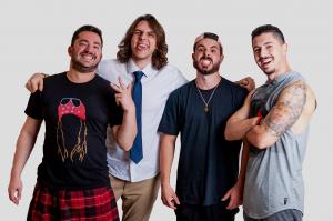 Group of four healthy, happy men standing together, symbolizing vitality, strength, and men’s health supported by Performance Center for Men.