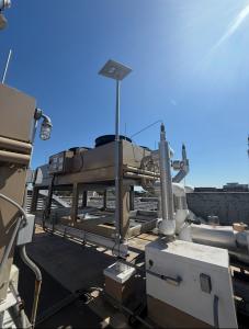 DishNinjas commercial Starlink installation featuring multiple satellite dishes with professional cable management, secure mounting hardware, and complete IT network infrastructure on commercial rooftop