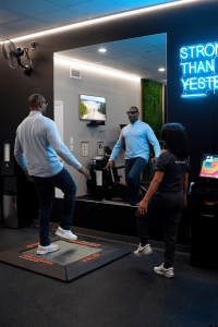 Clinician supervising balance testing on VALD ForceDecks at MetaLab inside Confidia Health Institute in Bristol, Connecticut, capturing real-time data on strength, symmetry, and stability.