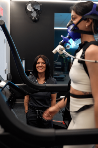 Clinician coaching a patient during VO₂ Max testing with the PNOĒ system at MetaLab in Bristol, Connecticut.