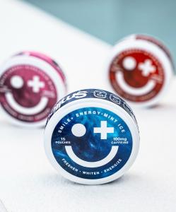 Smile+ ENERGY oral caffeine pouch container showing 100 mg caffeine in a mint ice flavor