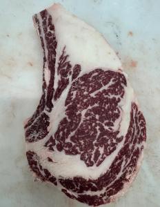 A beautifully marbled ribeye steak from Finke Farms Beef.