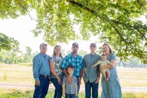 The Finke Family posing for a picture on their family ranch.