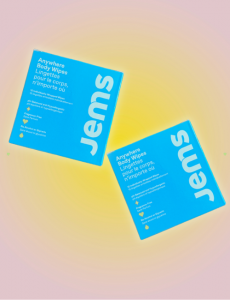 Individual body wipes from Jems on a colored background.