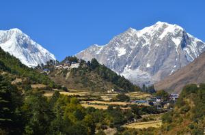 Traditional village on the Manaslu Circuit Trail with the Manaslu Himalayas towering in the background