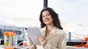 Creative Repute team member using a tablet during a strategy and design planning session in a Philadelphia studio.