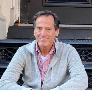  Close-up of Howard Steinberg sitting on a black staircase