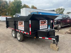 KDR Dumpster Rental trailer positioned at a construction job site in Southeast Michigan.