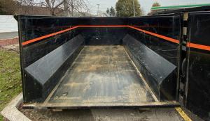 Interior of a clean dumpster container ready for renovation and construction debris.