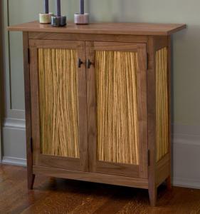 The expert craftsmanship and Shaker-inspired design of this cabinet accentuate the stunning natural grain of walnut and zebrawood.