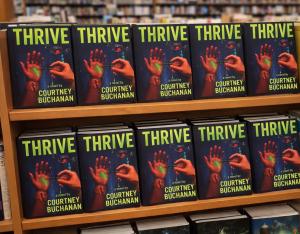 THRIVE book cover by author Courtney Buchanan, a dystopian science fiction novel about a futuristic vaccine and societal control.