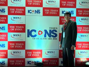 Dr. Amit Kumar Thotakura, Senior Consultant Neurosurgeon at Dr. Rao’s Hospital, poses at the Times ICONs of Healthcare 2026 backdrop during the awards ceremony held in Vijayawada, Andhra Pradesh.