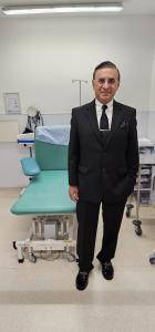 Mr Haider Syed Urologist next to bed