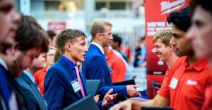 A group of Rose-Hulman students interact with employers at the 2025 fall career fair.