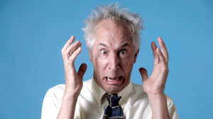 showing a frantic disheveled Robert Post with wild hair and eyes