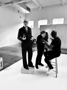 BTS Photo of actor/photographer Billy Zane with comedian Charles Fleischer and subject, Gallerist Will Phearson in black and white tones. The image shows the three of them in part of Billy Zane's new gallery exhibition, "A GUY WALKS INTO A BAR" at the Los