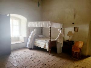 a bedroom of the mission with two sisters of the valley making up the bed