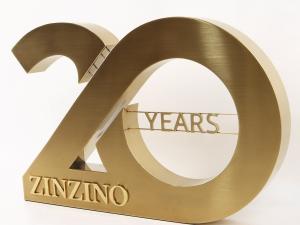 Close-up of high-quality metallic Zinzino signage showing precision brushed finish, manufactured by LC Sign’s MaaS model.