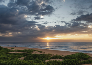 Sunrise over the Orange County coastline symbolizing recovery, hope, and new beginnings