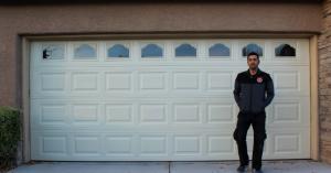 Open Sesame Garage Door Repair technician fixing a custom wood garage door on a luxury home in Ascension Summerlin South