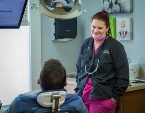 South Bend dentist Dr. Nicole Hurcomb talking to dental implants patient at Tulip Tree Dental Care