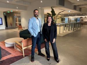 Man and woman standing in an office