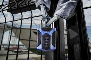 Squire's CP50ATLS combination padlock locking a gate