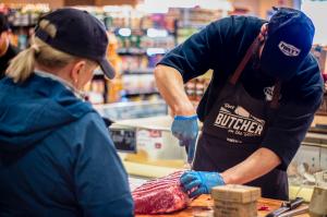 A Tony’s Market butcher hand-trims a whole beef primal during Butcher Days.