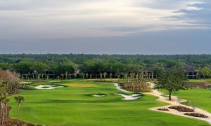 Aerial view of Vineyards Country Club’s renovated North Course in Naples, Florida, showcasing manicured fairways, sculpted bunkers, native landscaping, and surrounding residences under a wide sky.