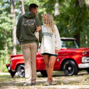 Palmetto Moon - Couple Walking in Woods
