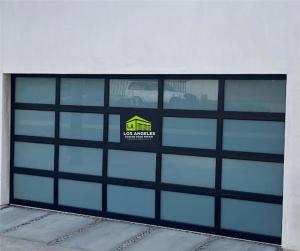 Emergency garage door off-track repair service being performed in the Silver Lake neighborhood of Los Angeles.