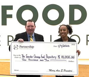 PFCU presents the Greater Chicago Food Depository a check for $10,000.