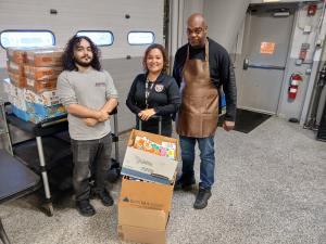 A Greater Chicago Food Depository Food Pantry receives a donation of 4 boxes of food from PFCU.