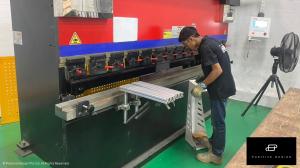 A Positive Design Employee Crafting Shop Components In The Factory