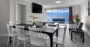 Condo with table and chairs and living area.