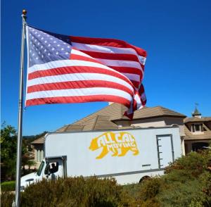 All Cal Moving Systems moving truck with the American flag, parked during a residential move in Visalia, California.