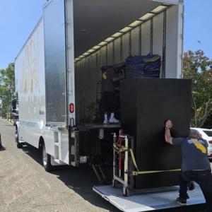 All Cal Moving Systems movers packing boxes and furniture into a truck, ensuring items are secure during a residential move in Visalia, California.