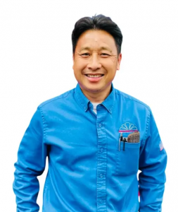 Nou Vang, owner of Mechanical Air, standing in Fresno, CA.